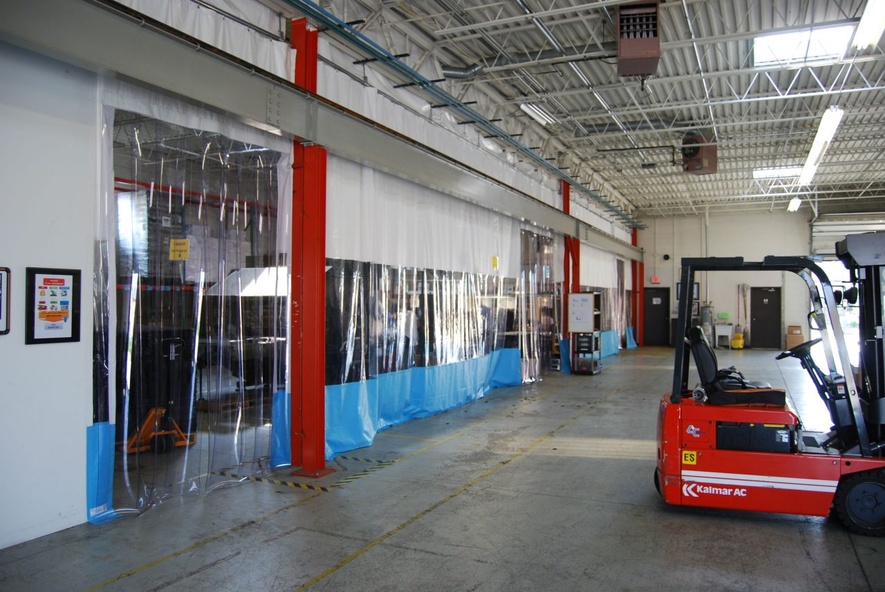 build-out-warehouse-space-create-separation-industrial-curtain-walls-AmCraft-Manufacturing